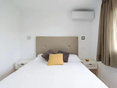 Cama o camas de una habitación en Las Burrras Buigues Beach
