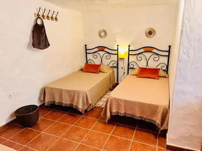 Cama o camas de una habitación en Cueva El Retamal