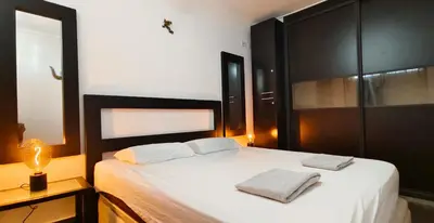 Cama o camas de una habitación en Lizards Lounge - Tanife Apartment beim Yumbo