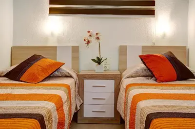 Cama o camas de una habitación en Los Elefantes Beach House