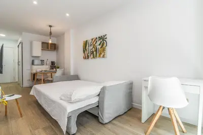 Cama o camas de una habitación en Nomad, Wifi , Espacio trabajo ,Playa ,Ocio