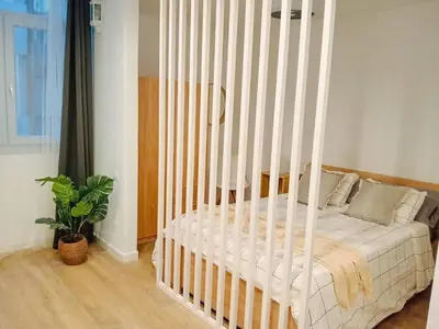 Cama o camas de una habitación en Nomad, Wifi , Espacio trabajo ,Playa ,Ocio