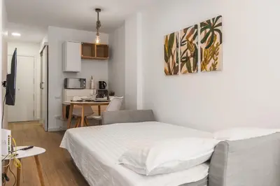 Cama o camas de una habitación en Nomad, Wifi , Espacio trabajo ,Playa ,Ocio