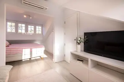 Una televisión o centro de entretenimiento en Bungalow en Pasito V6