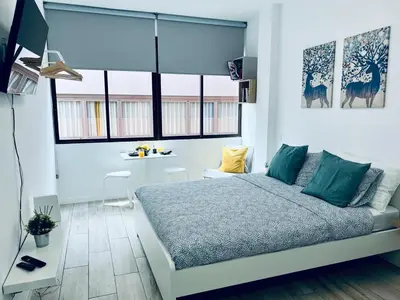 Cama o camas de una habitación en Coqueto apartamento a 50 metros de la playa