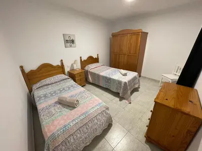 Cama o camas de una habitación en Apartamento Playa I & II Arinaga