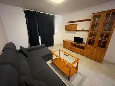 Una televisión o centro de entretenimiento en Apartamento Playa I & II Arinaga