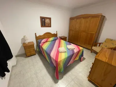 Cama o camas de una habitación en Apartamento Playa I & II Arinaga