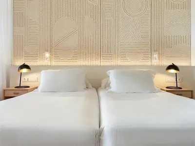 Cama o camas de una habitación en H10 Playa Meloneras Horizons Collection