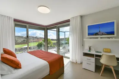 Cama o camas de una habitación en Los Dragos 13 Salobre by VillaGranCanaria