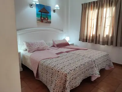Cama o camas de una habitación en Bungalow Santa Fe bien ubicado