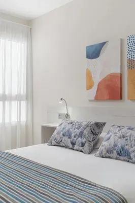 Cama o camas de una habitación en Las Afortunadas - Playa Arinaga 1ºD