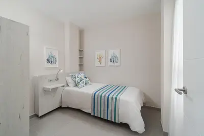 Cama o camas de una habitación en Las Afortunadas - Playa Arinaga 2ºA