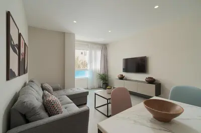 Una televisión o centro de entretenimiento en Las Afortunadas - Playa Arinaga 2ºB