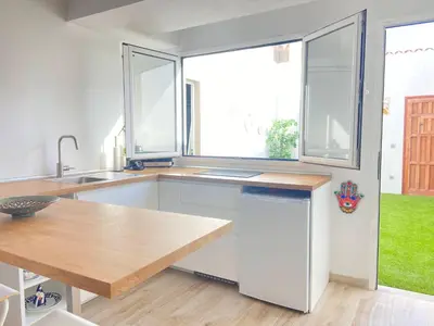 Una cocina o zona de cocina en Casita Estrella con entrada independiente y patio