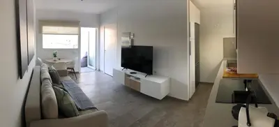 Una televisión o centro de entretenimiento en Blanco Homes & Living 1 By SunHousesCanarias