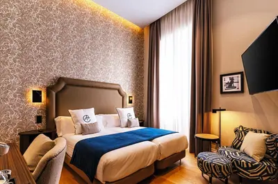 Cama o camas de una habitación en Boutique Hotel Cordial Plaza Mayor de Santa Ana