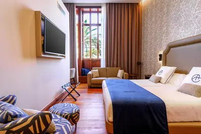 Cama o camas de una habitación en Boutique Hotel Cordial Plaza Mayor de Santa Ana