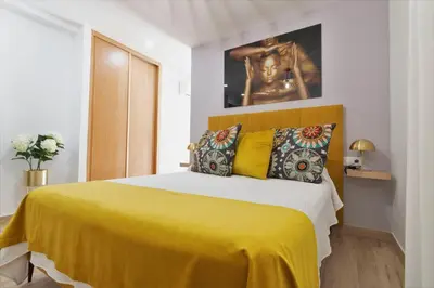 Cama o camas de una habitación en THE GOLDEN CORNER by Homestaygrancanaria