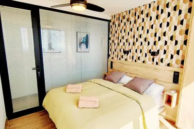 Cama o camas de una habitación en Ojo de Halcón by CASAS COCODRILO