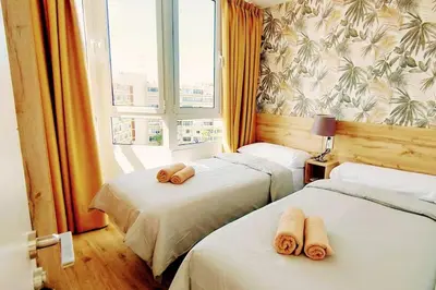 Cama o camas de una habitación en Ojo de Halcón by CASAS COCODRILO