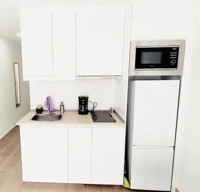 Una cocina o zona de cocina en Pequeño, céntrico y acogedor 4th by CASAS COCODRILO