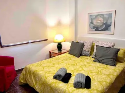 Cama o camas de una habitación en Luminoso y acogedor
