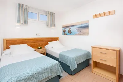 Cama o camas de una habitación en MUR Apartamentos Buenos Aires Gran Canaria