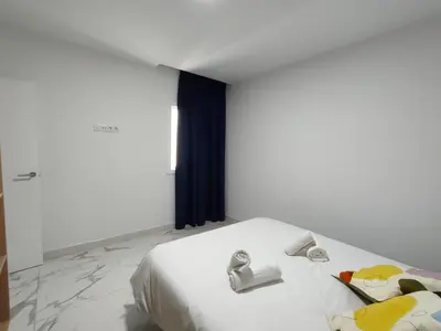 Cama o camas de una habitación en HOLA SUITE