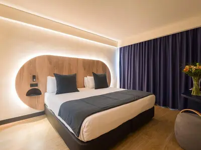 Cama o camas de una habitación en Sercotel Playa Canteras