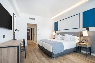 Cama o camas de una habitación en Hotel LIVVO Fataga