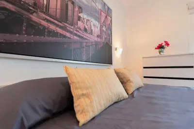 Cama o camas de una habitación en APARTAMENTO SCORPIO 514 by Homestaygrancanaria