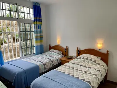 Cama o camas de una habitación en Casa Lindi - Apartment near Puerto Rico beach