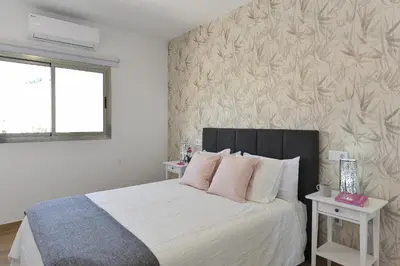 Cama o camas de una habitación en Apartamento Starlight La Aldea II