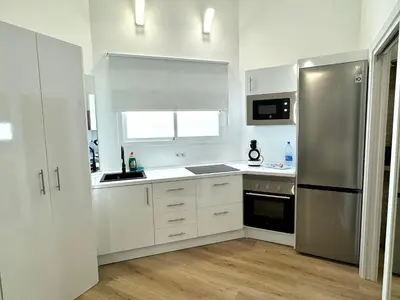 Una cocina o zona de cocina en Loft Deluxe Aeropuerto