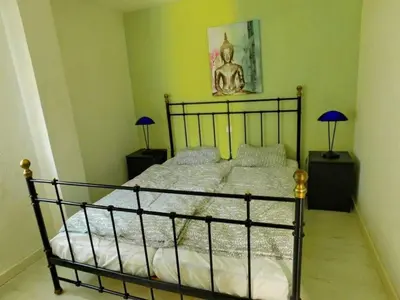 Cama o camas de una habitación en Beautiful 2 bedroom apartment near Puerto Rico beach