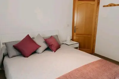 Cama o camas de una habitación en apartment with garden a few minutes from the sea