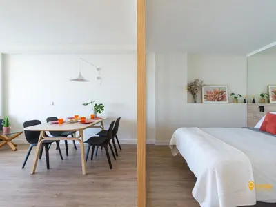 Cama o camas de una habitación en Living Las Canteras Homes - STYLISH BEACHFRONT