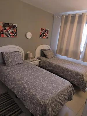 Cama o camas de una habitación en Sea view cozy apartment with pool