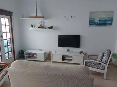 Una televisión o centro de entretenimiento en Casa La Palmera