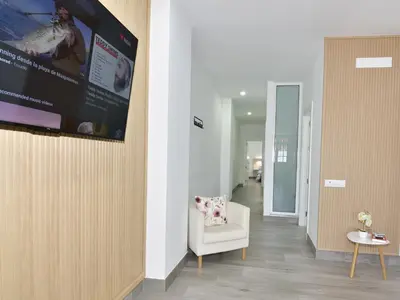 Una televisión o centro de entretenimiento en Suite Orquídea