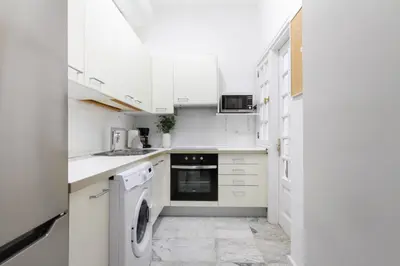 Una cocina o zona de cocina en Bungalow con jardín en Pasito PM40