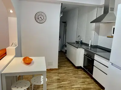 Una cocina o zona de cocina en HomeForGuest Amplio apartamento con piscina y terraza en Mogan