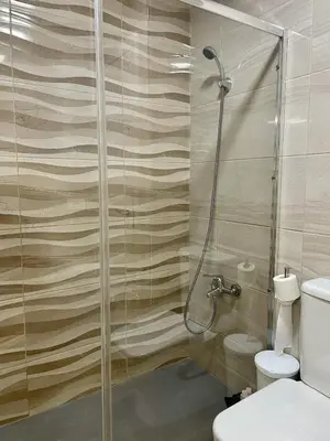 Un baño de HomeForGuest Amplio apartamento con piscina y terraza en Mogan