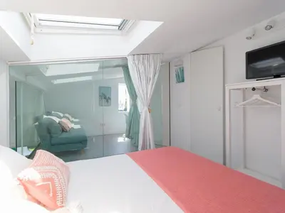 Cama o camas de una habitación en Aquarium Bungalow private jacuzzi, 3 bedrooms, AC and Bikes