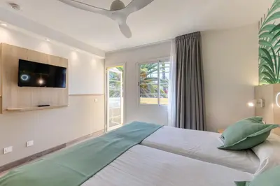 Cama o camas de una habitación en Bungalows Cordial Green Golf