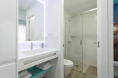 Un baño de Petit Accommodation Las Canteras Deuxième