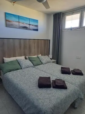 Cama o camas de una habitación en Yumbo Holiday Apartment - Tanife CAS