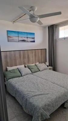Cama o camas de una habitación en Yumbo Holiday Apartment - Tanife CAS