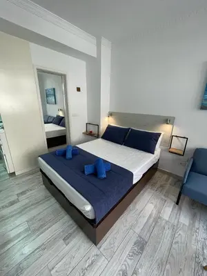 Cama o camas de una habitación en PALMERAS 102